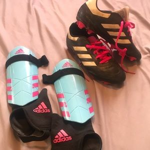 Girls soccer cleats and shin pads